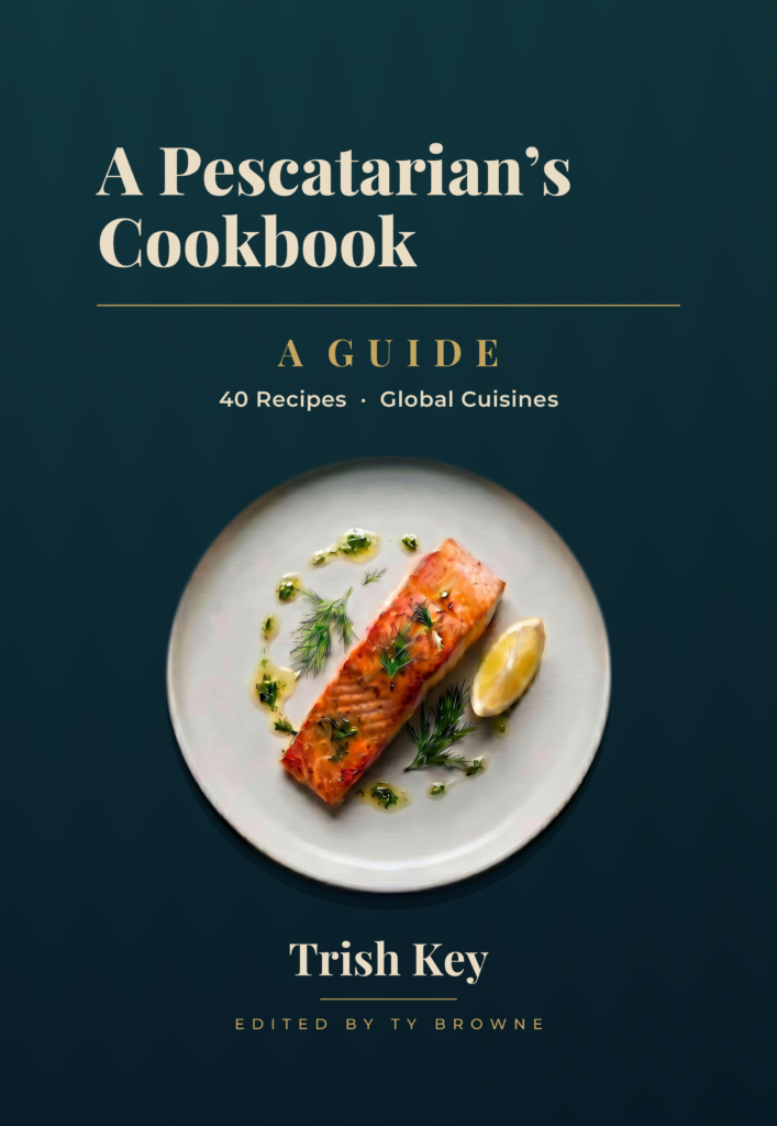 A Pescatarian’s Cookbook hardcover front cover by Trish Key, a plated salmon dish with dill and lemon